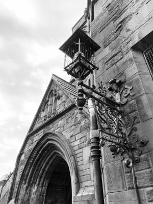 Black and White Image of gothic style arch above door